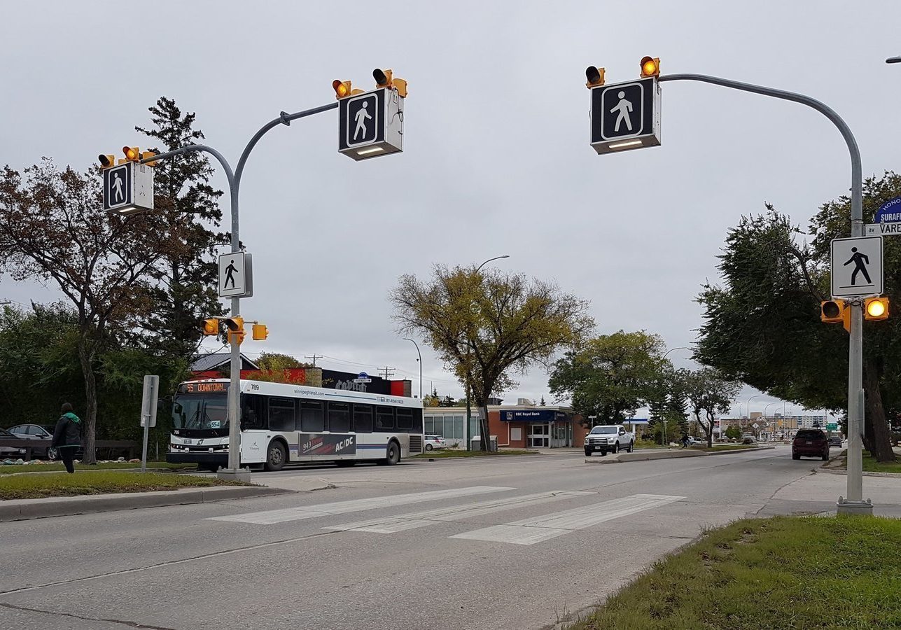 A rendering of a pedestrian crosswalk across Highway 2 with lights to indicate that pedestrians are crossing.